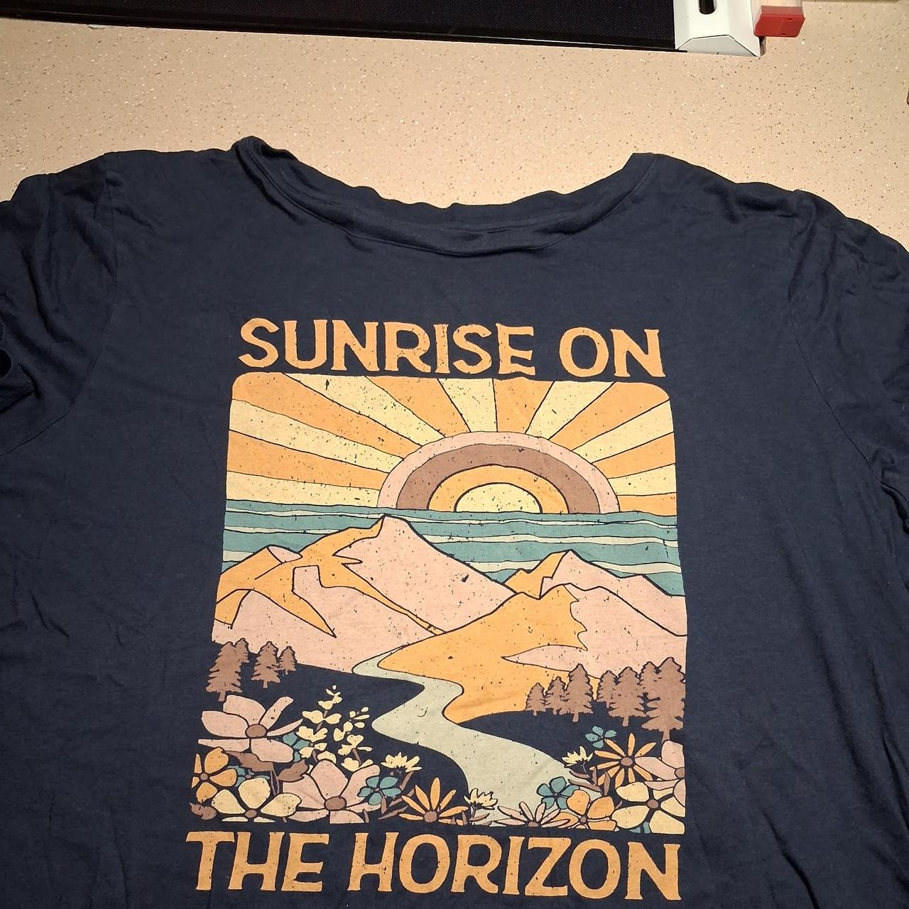Navy blue sunrise on the horizon graphic tee with...