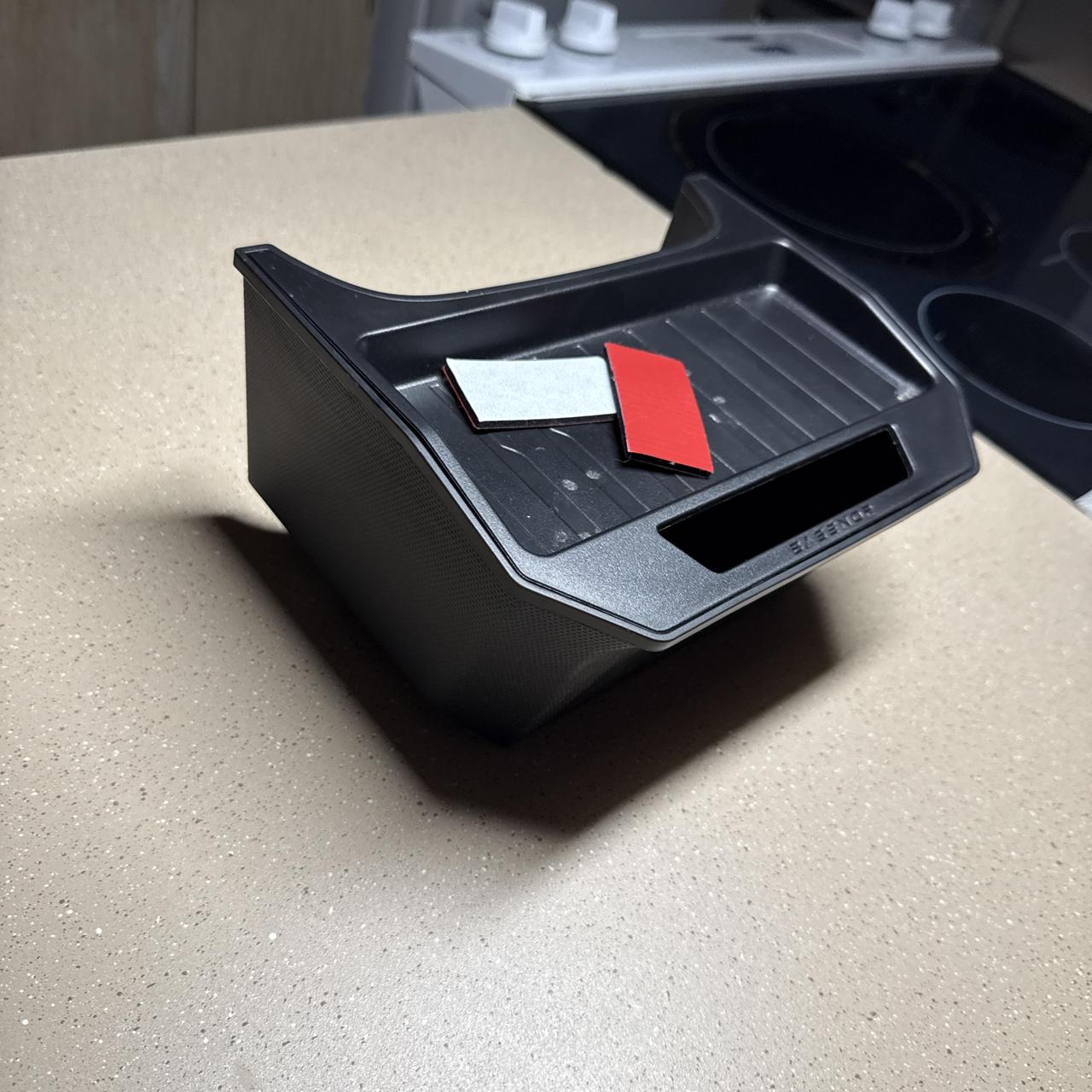 Tesla behind the center console extra Black plastic...