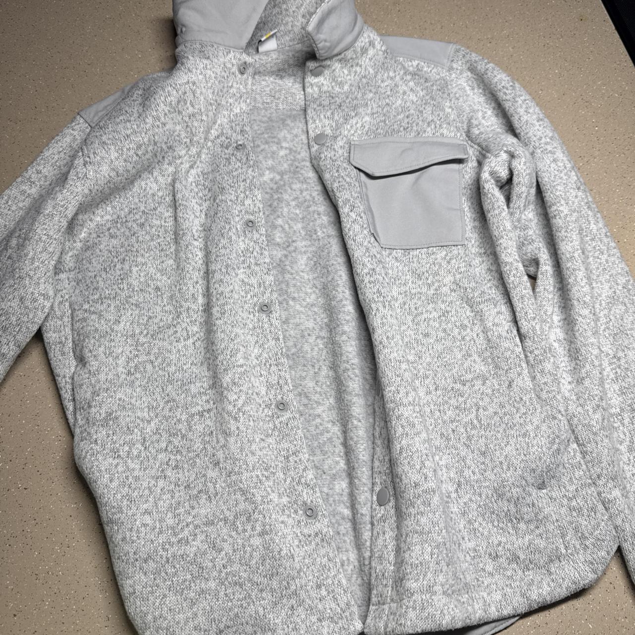 Gray heathered fleece jacket with a relaxed fit,...