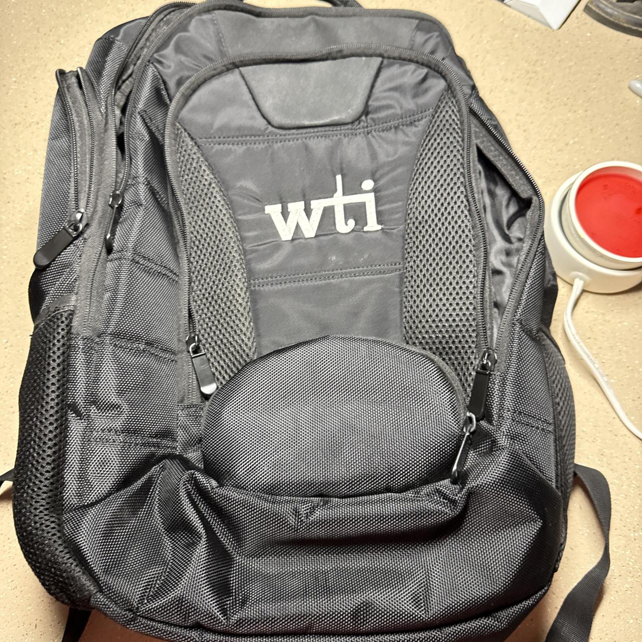 Black WTI backpack with white logo #workout #fitness