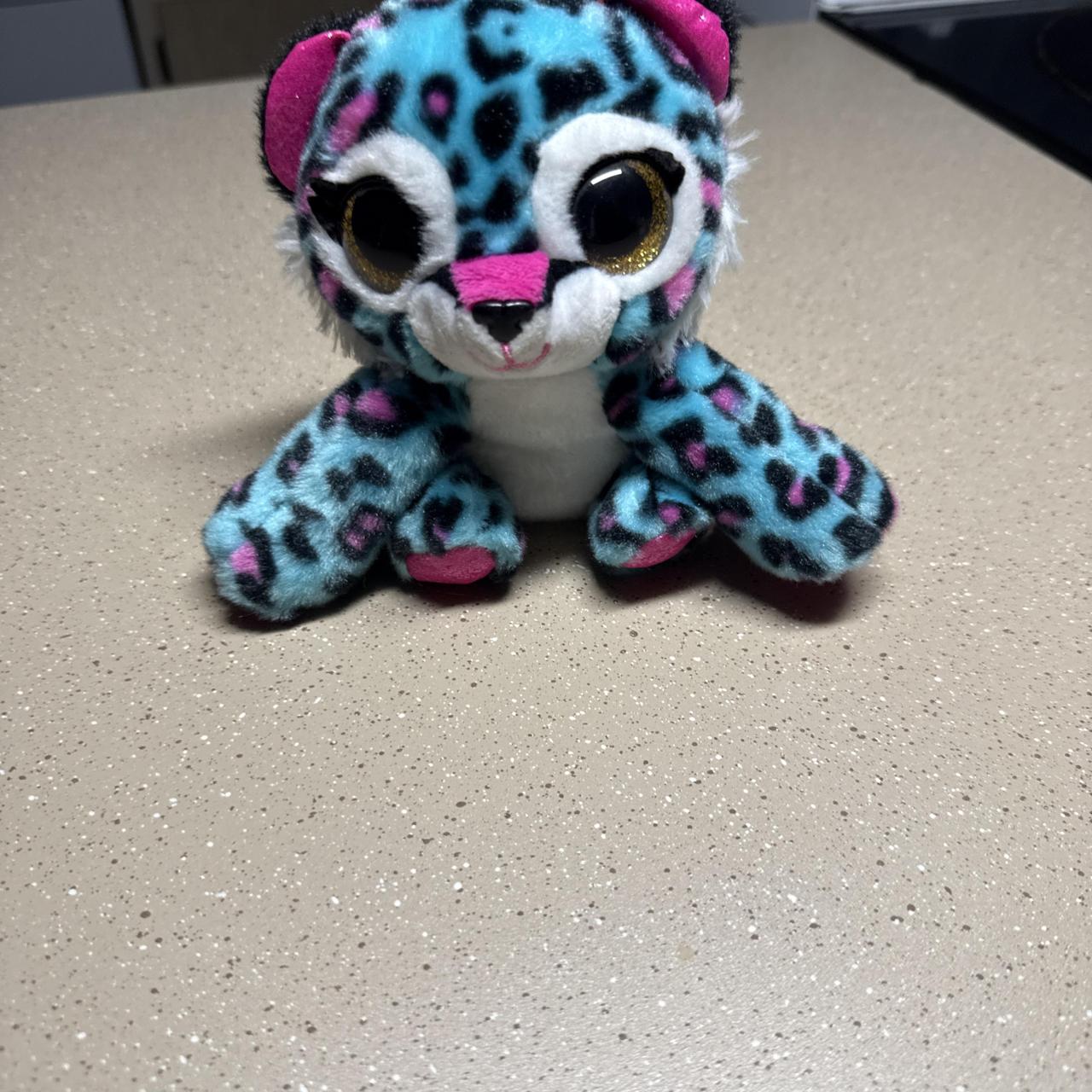 Coco the Leopard with blue, black, and pink leopard...