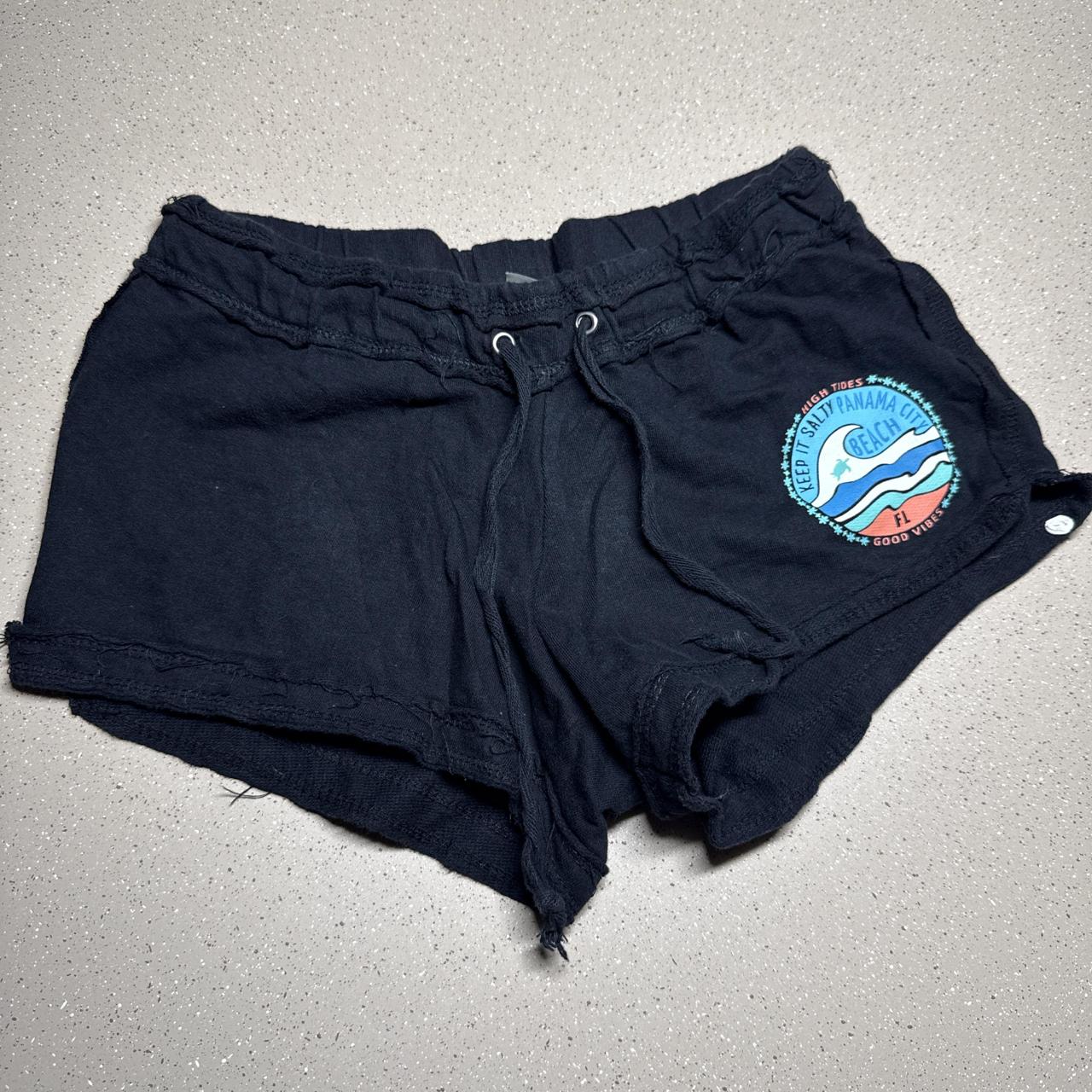 Black US Apparel shorts with blue and red circular...