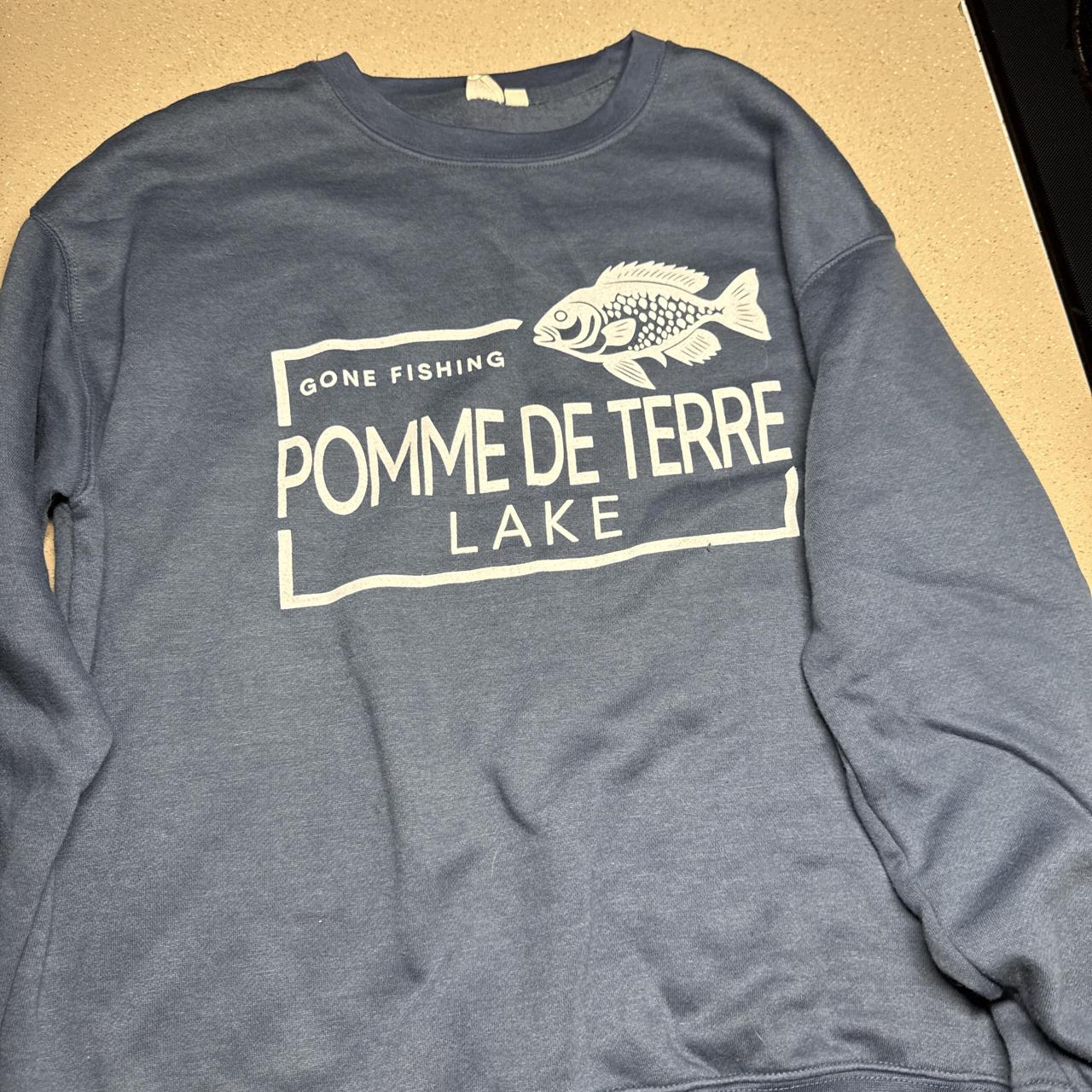 Blue crewneck sweatshirt with white graphic of a...